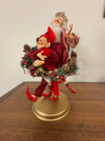 Santa Playing-Dancing The Hula Hoop Wreath with an Elf Holiday Figure Decor